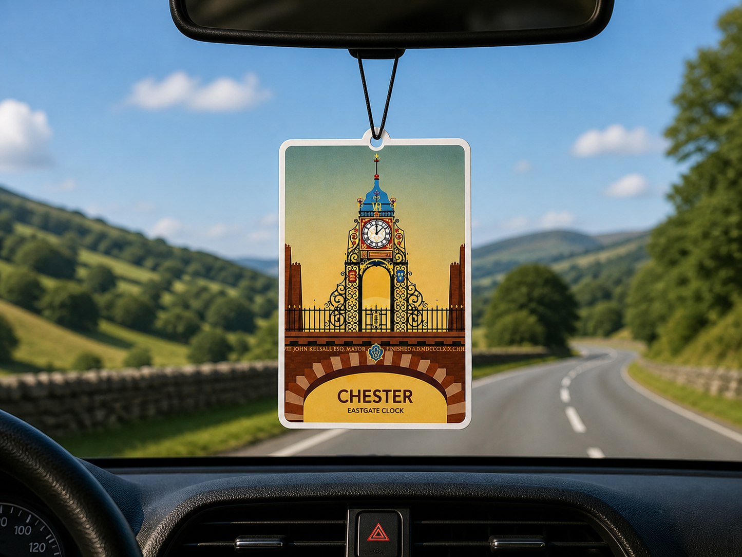 Car air freshener with Chester eastgate clock design hanging from a car's rearview mirror.