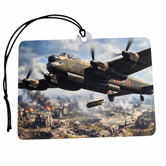 Avro Lancaster bomber inspired car air freshener featuring a WW2 RAF four-engine aircraft flying over a dramatic wartime landscape with black hanging cord.
