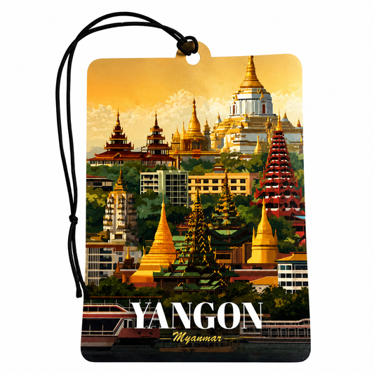 A rectangular luggage tag or car air freshener tag with a black hanging cord, printed with a colorful illustration of Yangon, Myanmar, featuring golden stupas and temples against a warm yellow sky. The word 'YANGON' is printed in large white letters at the bottom, with 'Myanmar' in smaller script underneath.