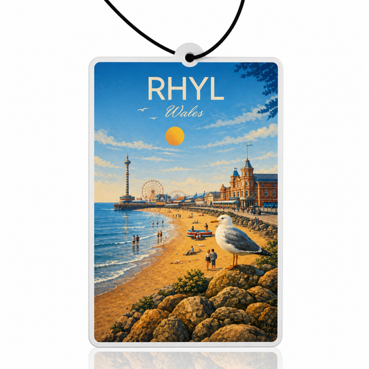 Car air freshener with a beach scene and 'RHYL Wales' text, featuring a seagull.