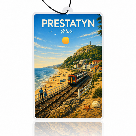 Decorative car air freshener of Prestatyn, Wales with a train on tracks by the beach.
