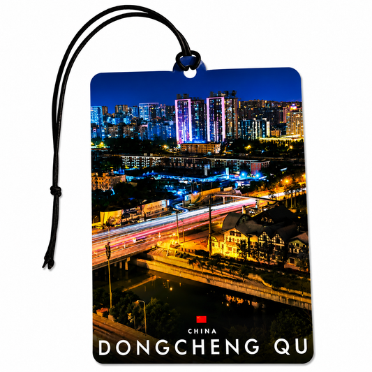 A rectangular car air freshener tag featuring a nighttime cityscape of Dongcheng Qu, China, with a black hanging cord and the text 'CHINA DONGCHENG QU' printed at the bottom, shown on a plain white background.