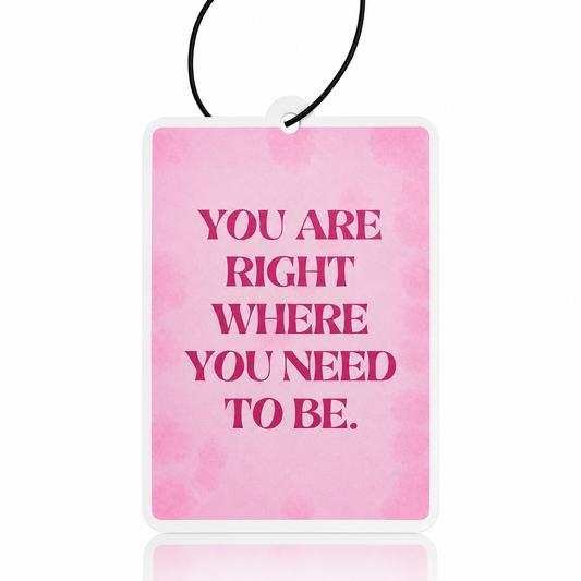 Pink watercolor car air freshener with motivational quote on a white background