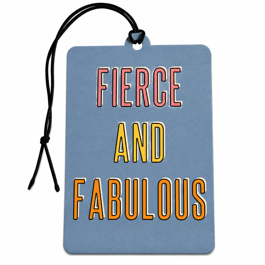 A rectangular blue car air freshener with rounded corners and a black hanging cord, printed with the phrase 'FIERCE AND FABULOUS' in large outlined letters. The words 'FIERCE' and 'AND' are pink/red outlined, and 'FABULOUS' is orange outlined, on a plain white background.