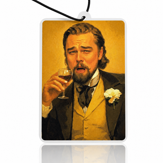 Car air freshener with a stylized depiction of a man holding a glass of wine, resembling a famous painting.