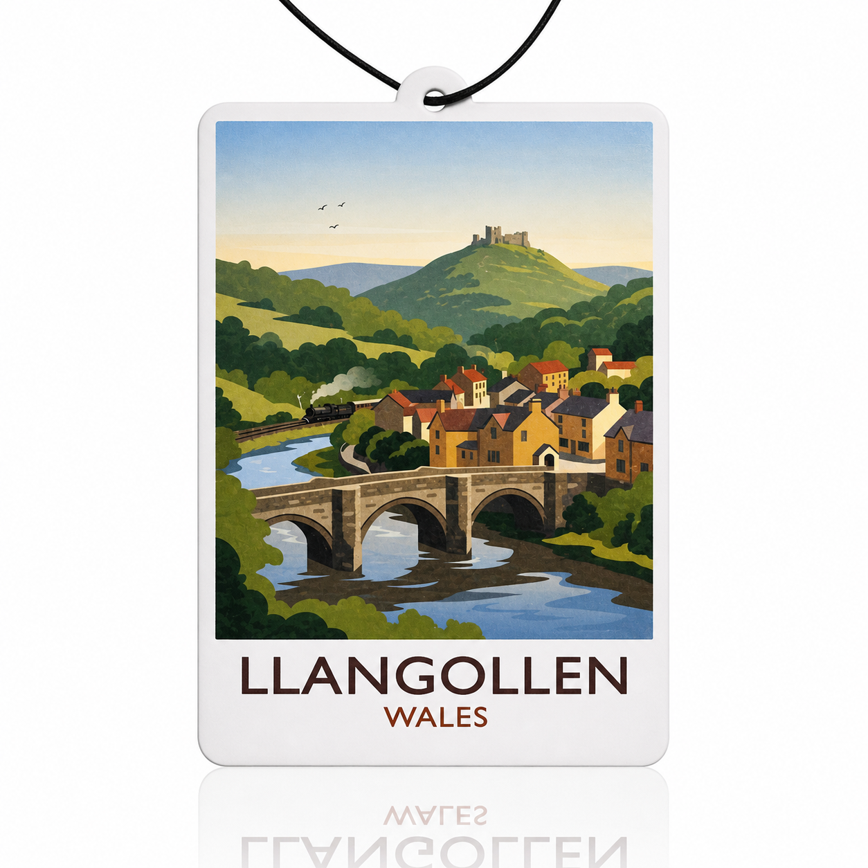 Car air freshener with a scenic view of Llangollen, Wales, featuring a bridge over a river and green hills.