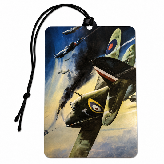 A rectangular luggage tag or car air freshener with a black hanging cord, printed with a vintage World War II fighter plane battle scene. The artwork shows olive-drab aircraft, smoke, and a blue sky with roundel markings.