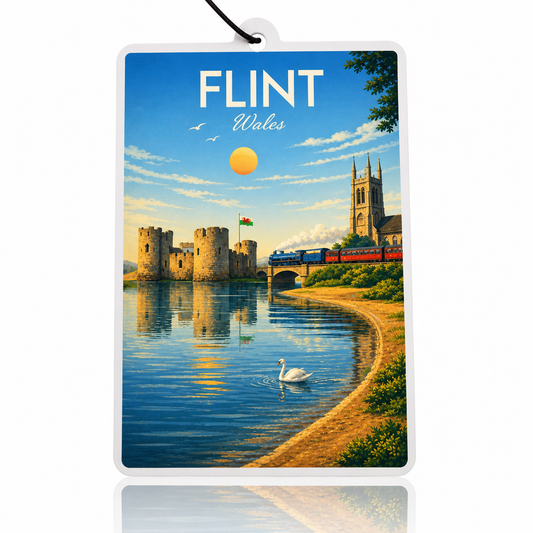 Car air freshener with a scenic view of a castle and train in Flint, Wales.